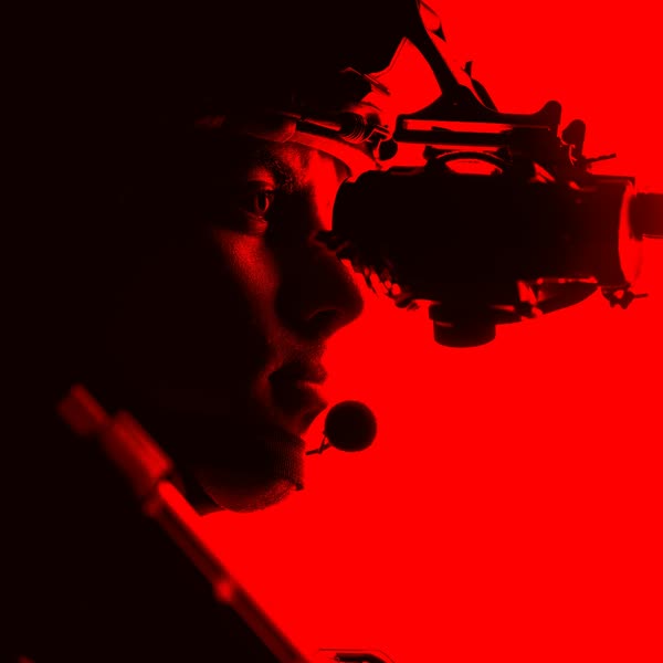 Cinematographer filming a narrative scene